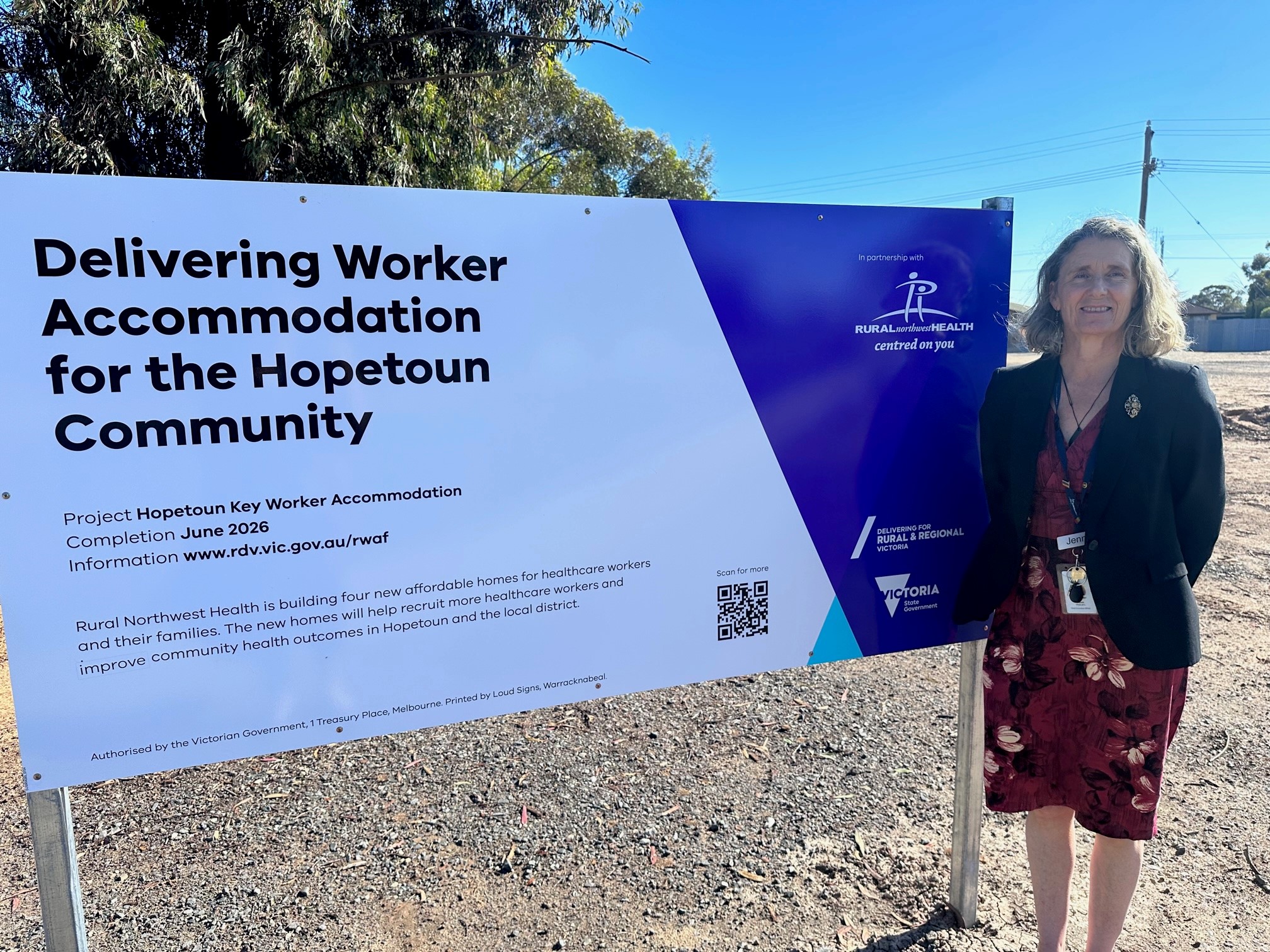 CEO Jenni Masters with sign on block