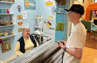 Betty Krahe serving great grandson